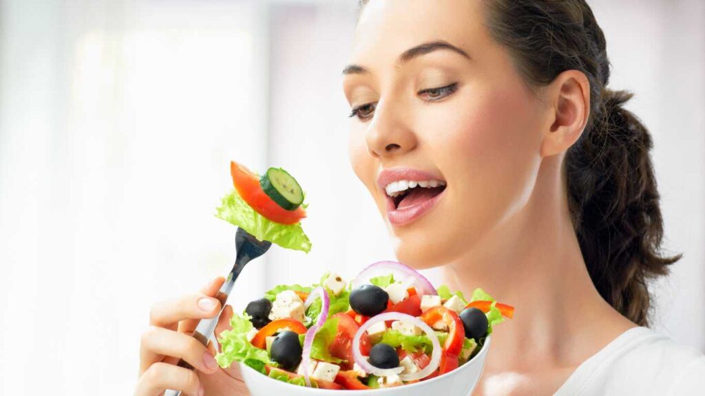 A woman eating Healthy salad 